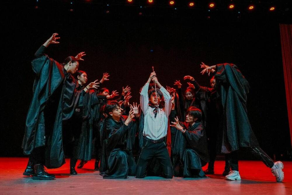 The cloaked ensemble in the code-courier sequence, lit in red