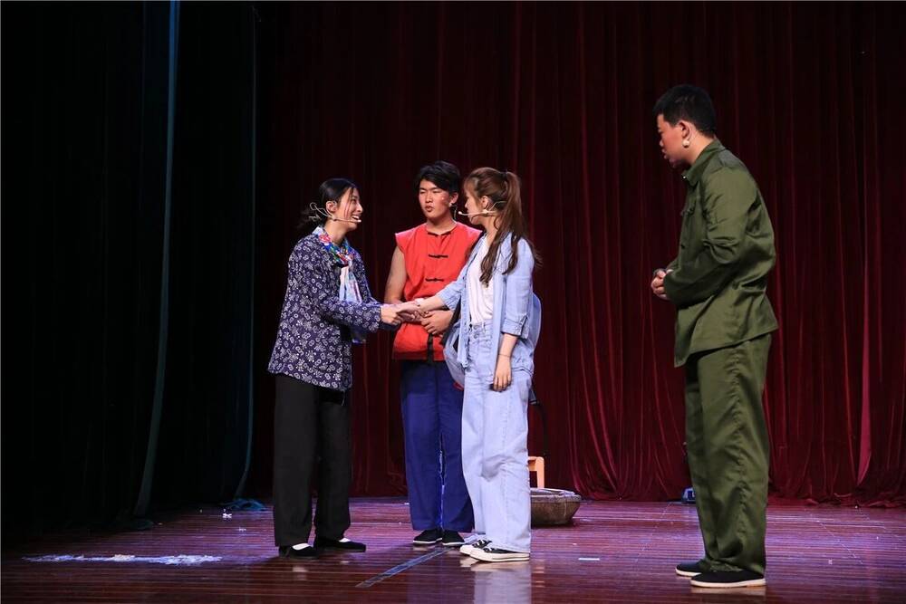 A scene from Blind Mountain with villagers and a man in a green uniform