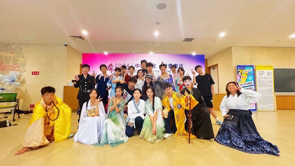 Students in costume gathered in a dance studio during a masterclass