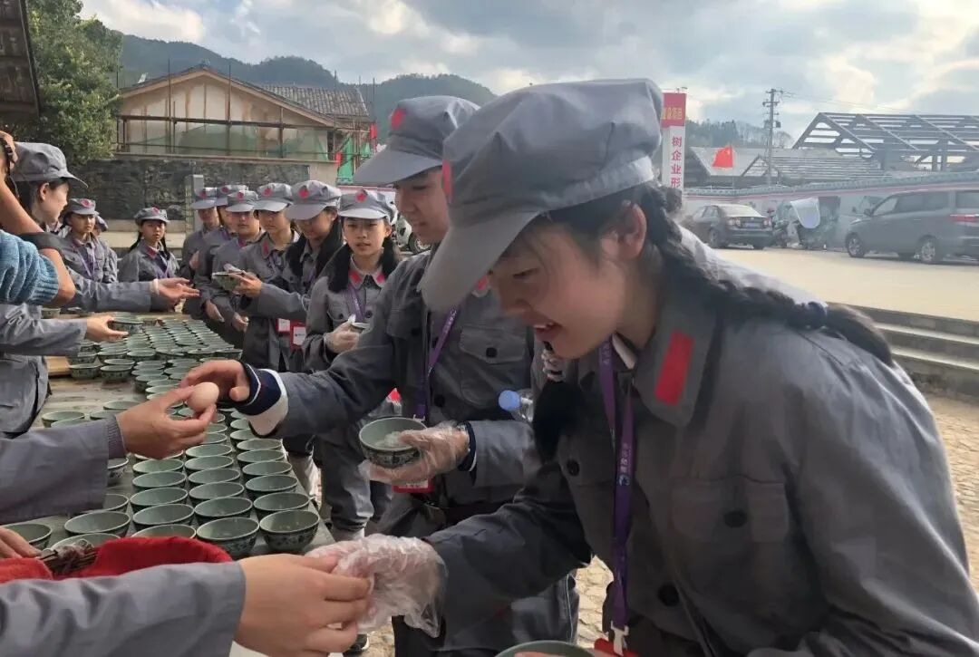 Students in Red Army uniforms taking part in a re-enactment activity on a school trip