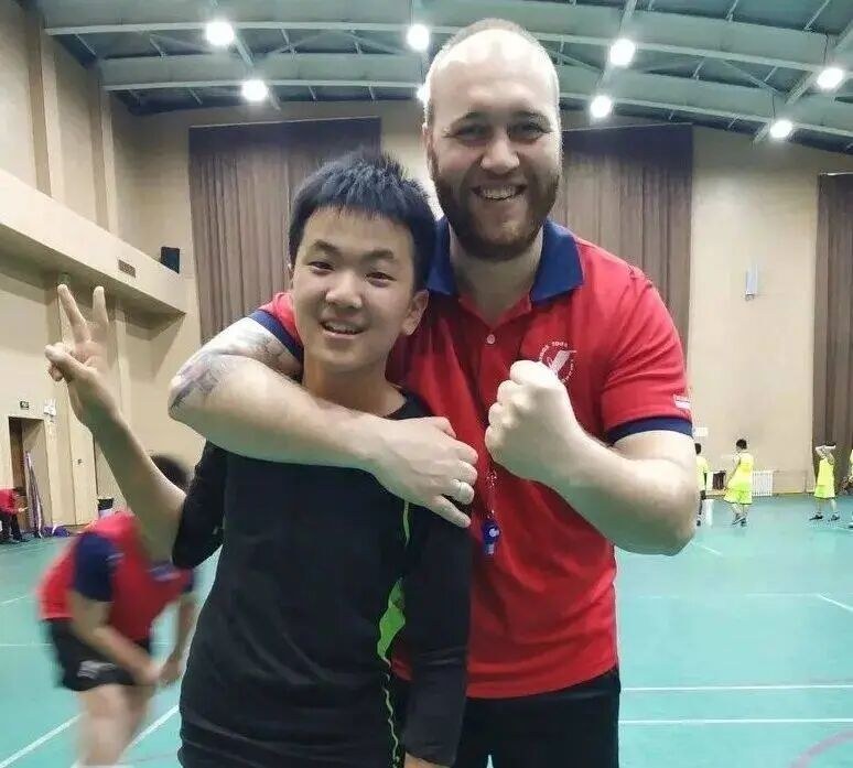 Ma Liangyu at the age of ten, in a school sports hall with his coach