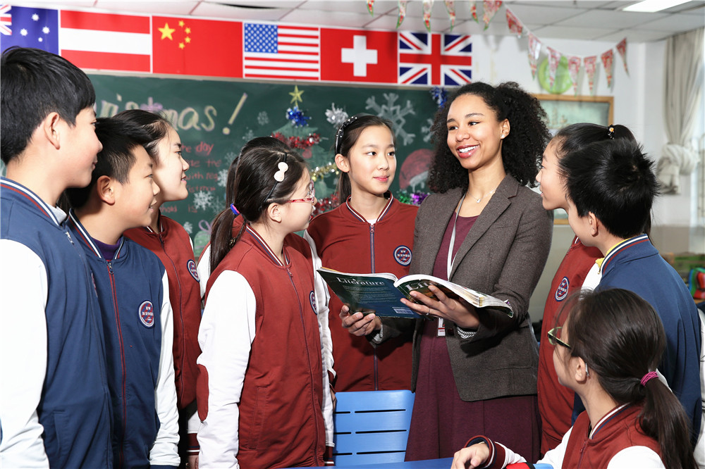 School students in a bilingual classroom with their teacher
